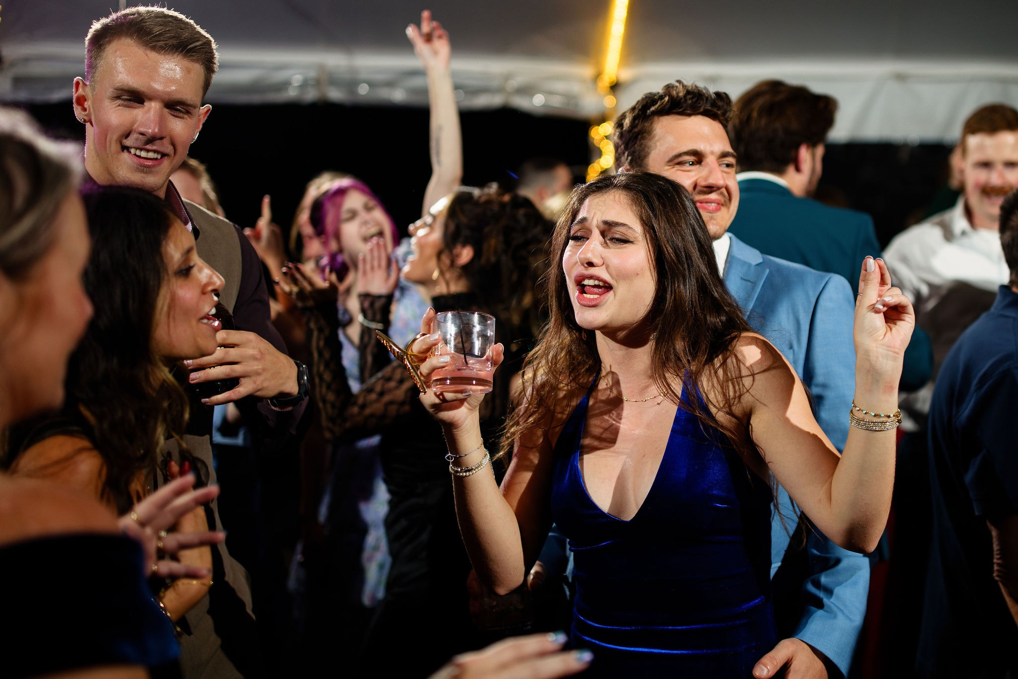Group celebrating at rooftop party night