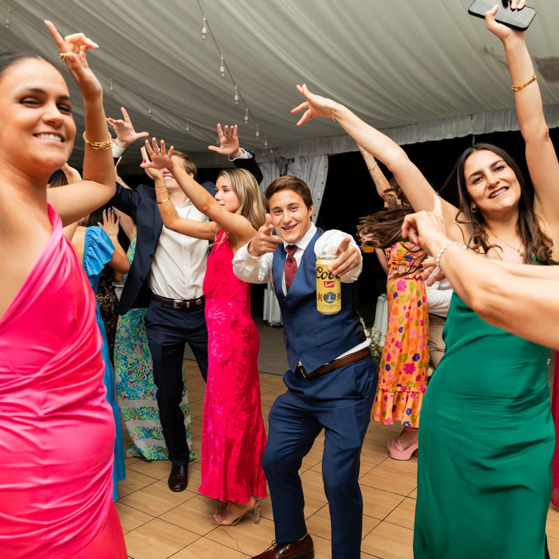 Guests dancing celebrating at wedding reception