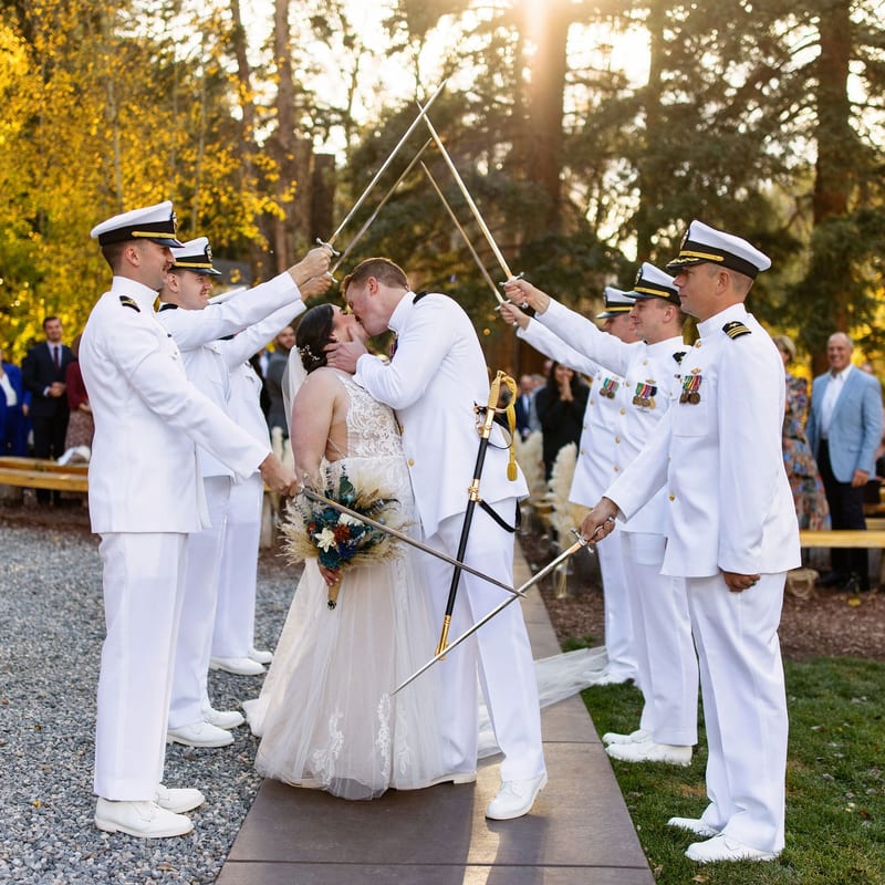 Military wedding ceremony sword arch kiss